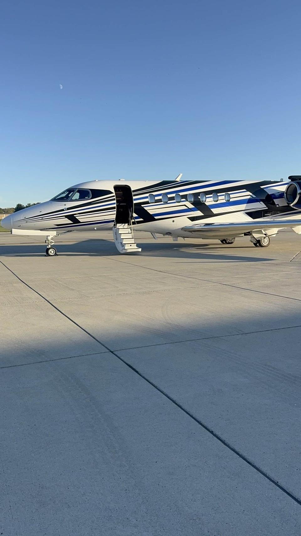 Private jet parked on a sunny tarmac