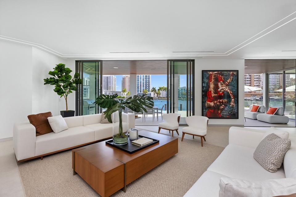 Villa Golden main living room with designer sofas and waterfront views, Golden Isles, Hallandale Beach luxury rental