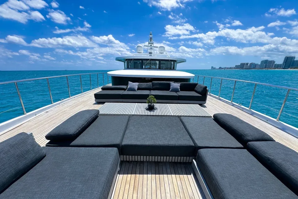 Bow lounge of the WHS 112 yacht facing open water and the Miami coastline