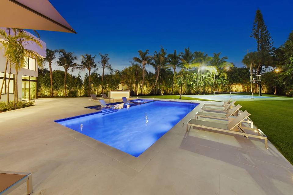 Villa Palma pool deck and loungers at dusk, Miami luxury rental