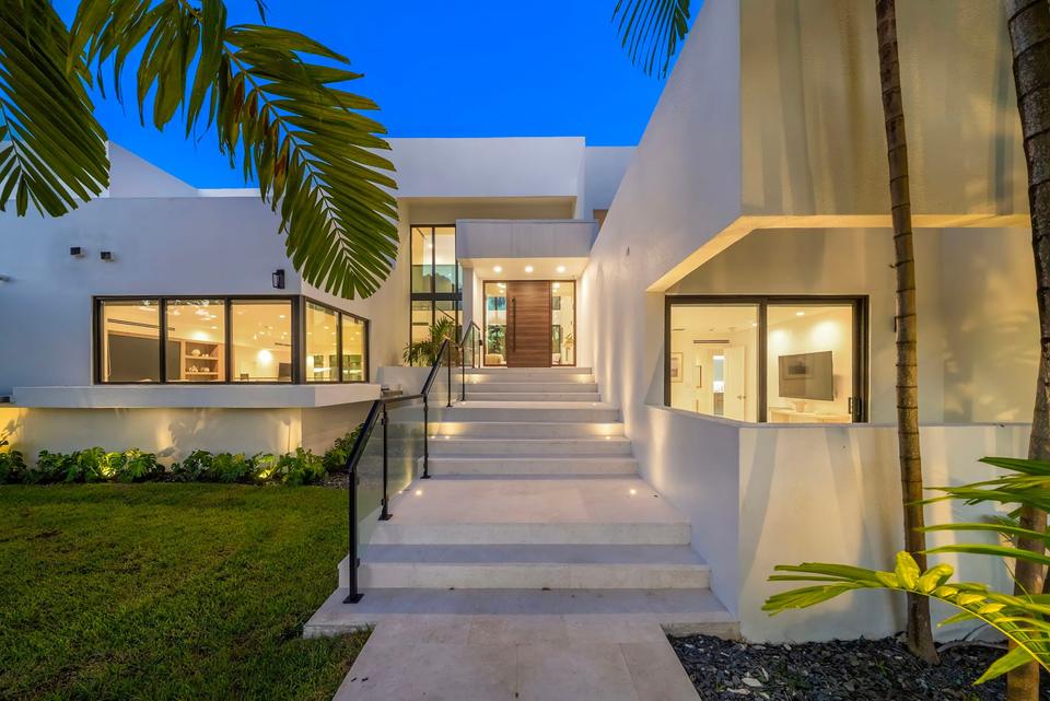 Villa Palma modern entry staircase at dusk, Miami luxury rental