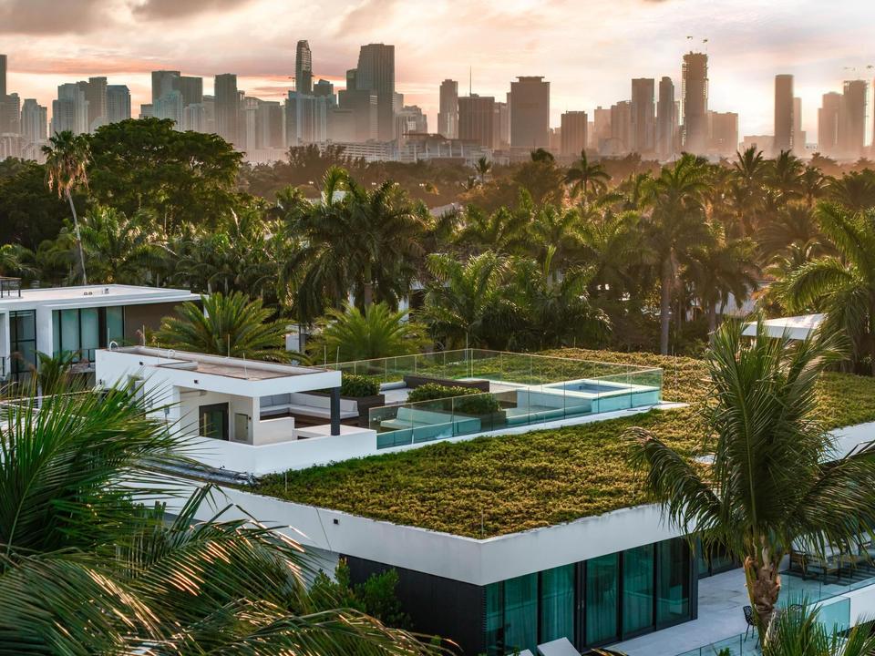 Aerial view of Villa Lavoro with the downtown Miami skyline across the bay, Miami Beach luxury rental