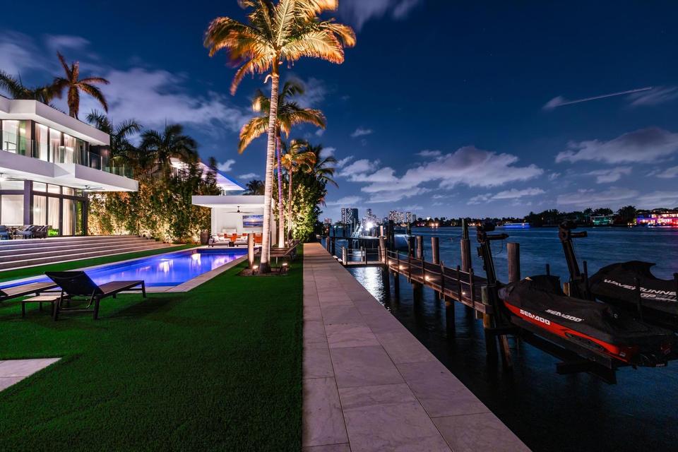 Private dock at night with bay views, Villa Lavoro, Miami Beach luxury rental