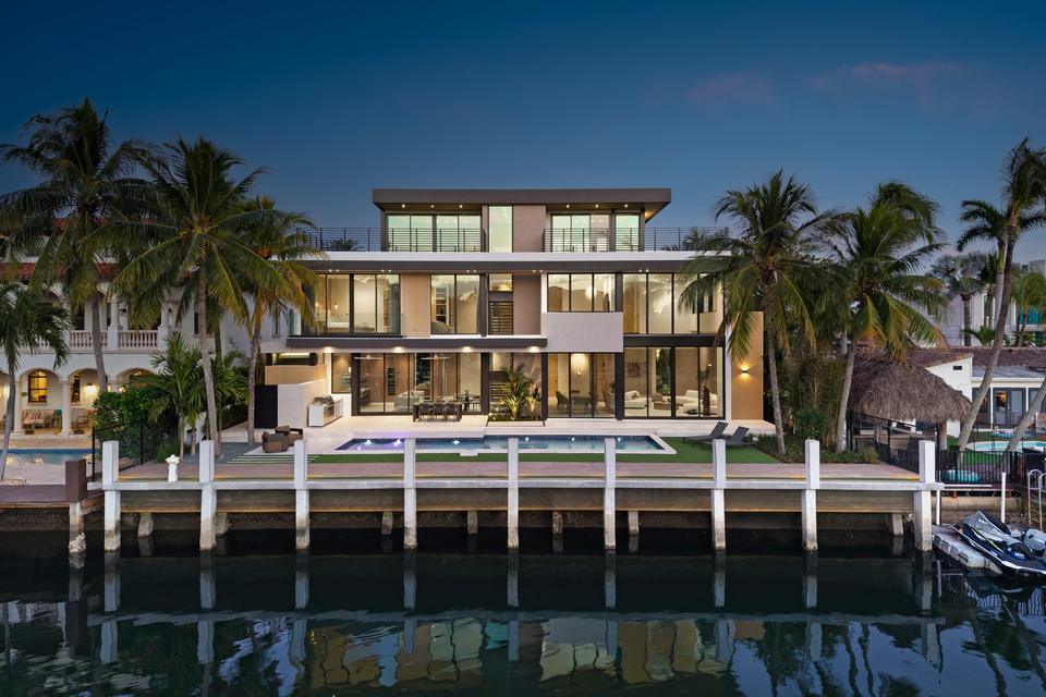 Villa Sia seen across the canal at twilight, Las Olas Isles, Fort Lauderdale luxury rental