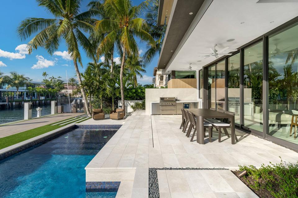 Outdoor kitchen and dining terrace by the pool, Villa Sia, Las Olas Isles, Fort Lauderdale luxury rental
