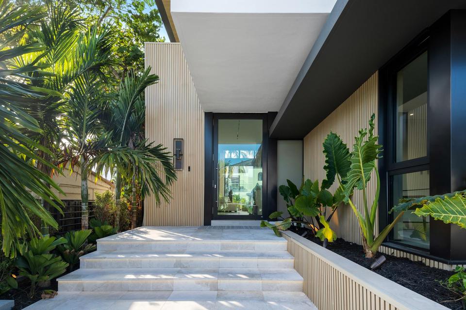 Entry walkway through a planted courtyard, Villa Sia, Las Olas Isles, Fort Lauderdale luxury rental