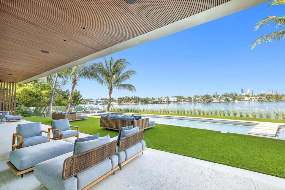 Covered lounge facing the lawn and the bay