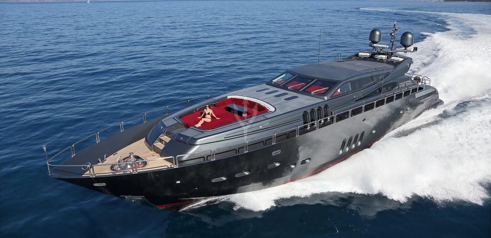 Dark-hulled sport yacht at speed, Miami