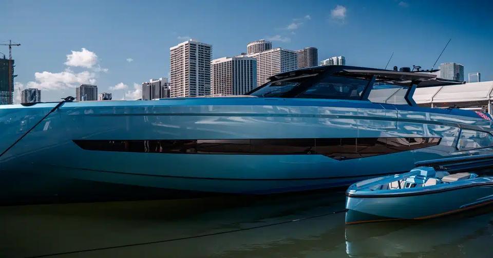 Yacht and tender moored with the Miami skyline behind