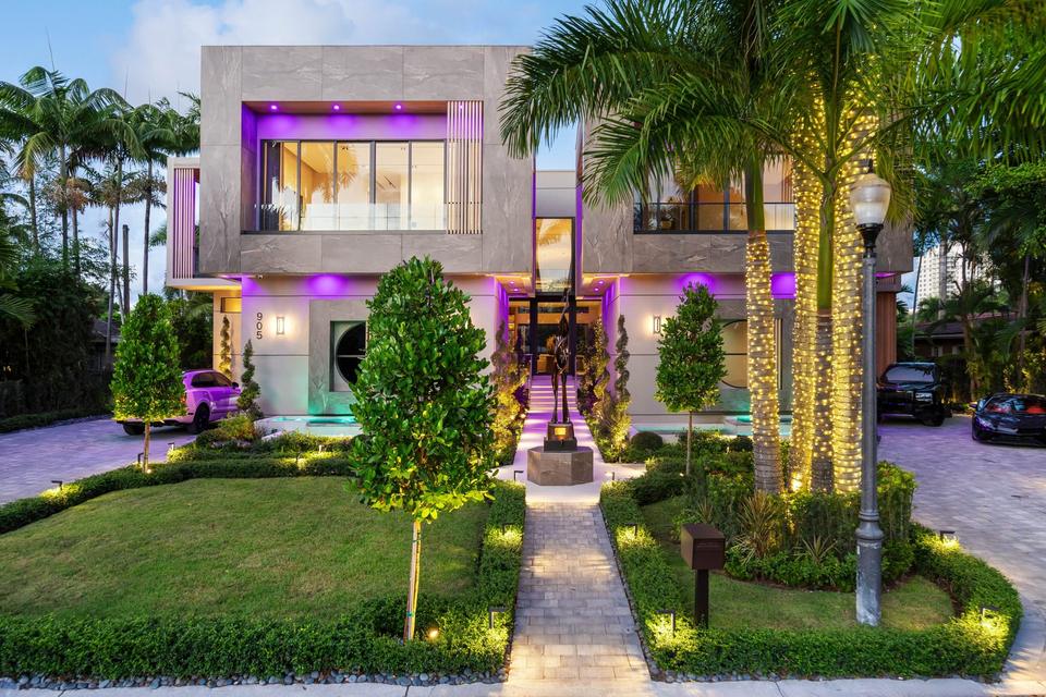 Villa Alpha facade lit at night