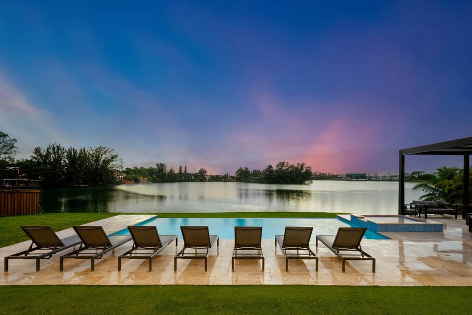 Villa Lago loungers facing the lake at sunset
