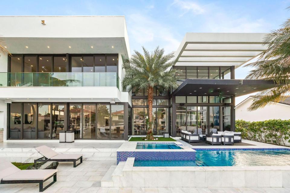 Rear facade and pool terrace in daylight, Villa Estan, Eastern Shores, North Miami Beach luxury rental