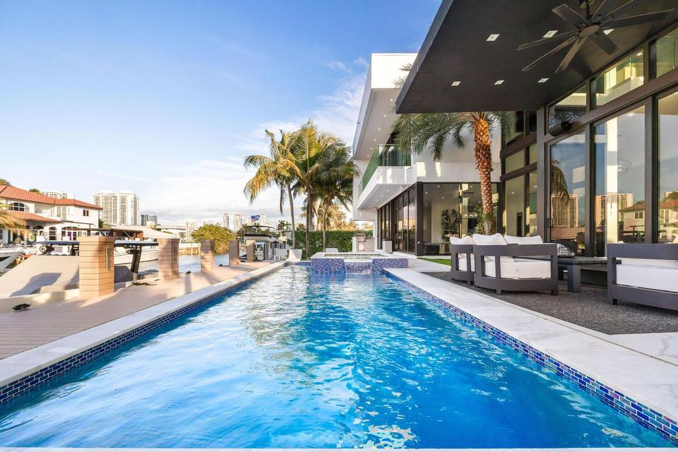 Resort-style pool running toward the waterway, Villa Estan, Eastern Shores, North Miami Beach luxury rental