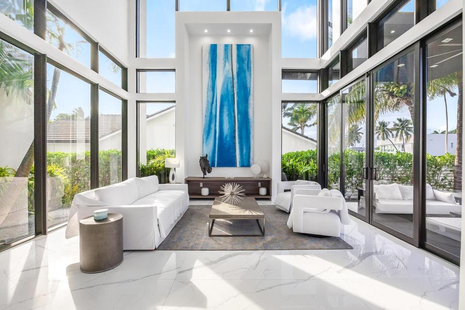 Double-height living room with white marble floors, Villa Estan, Eastern Shores, North Miami Beach luxury rental