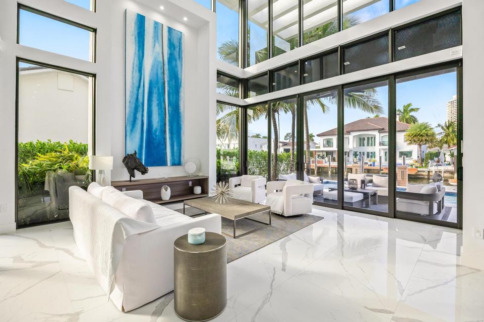 Living room with floor-to-ceiling glass to the terrace, Villa Estan, Eastern Shores, North Miami Beach luxury rental