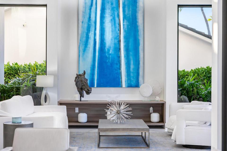 Sitting area with large blue artwork, Villa Estan, Eastern Shores, North Miami Beach luxury rental