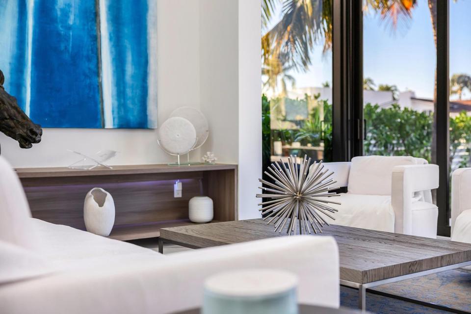 Sofa and coffee table beneath tall windows, Villa Estan, Eastern Shores, North Miami Beach luxury rental
