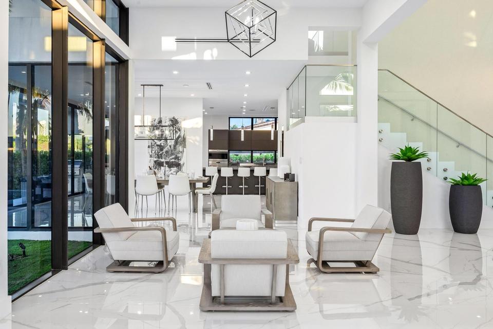 Entrance lounge with glass staircase, Villa Estan, Eastern Shores, North Miami Beach luxury rental