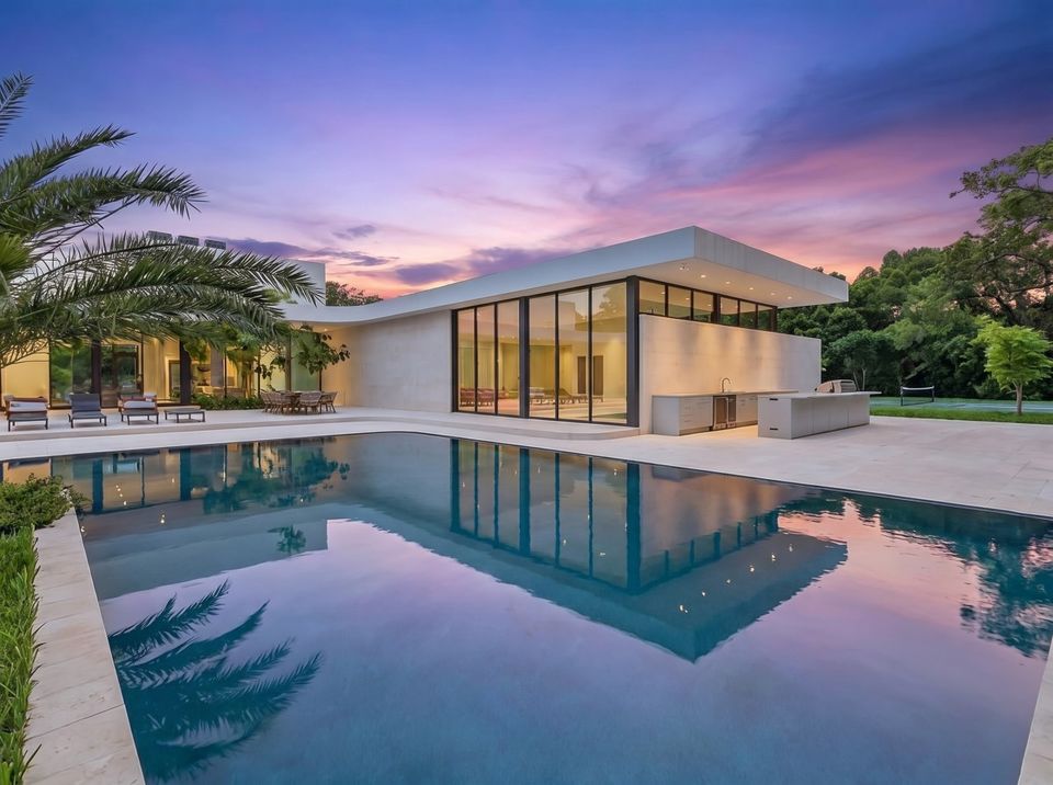 Pool at twilight with the modern single-level house behind, Villa Verano, Southwest Ranches