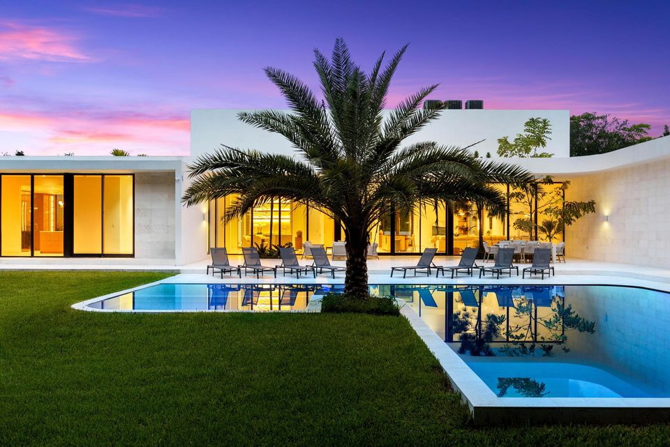Pool with a sun shelf and a royal palm at sunset, Villa Verano, Southwest Ranches