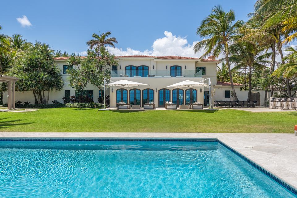 Pool and the Mediterranean style estate with blue shutters, Villa Ocean, Miami
