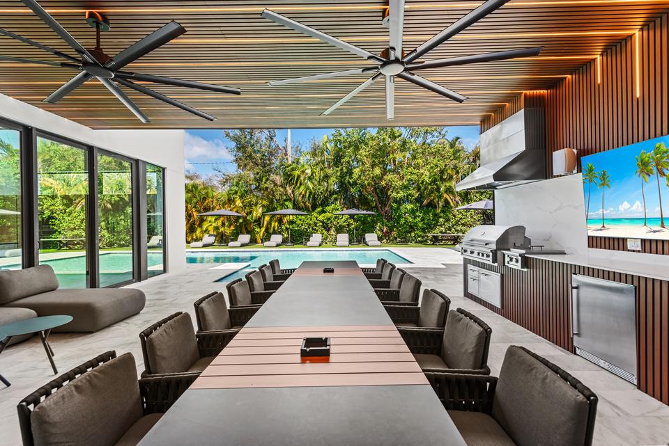 Outdoor dining and summer kitchen under the terrace, Villa Meimon, North Miami Beach