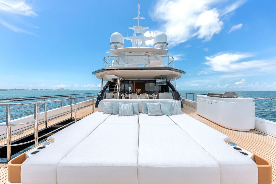 Wide bow sunpads on the 118 ft Azimut, where a proposal setup of roses and candles goes