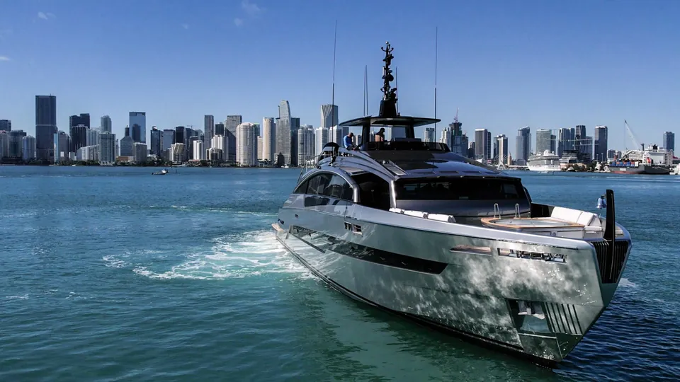 Pershing 116 yacht cruising on Biscayne Bay with the Miami skyline behind