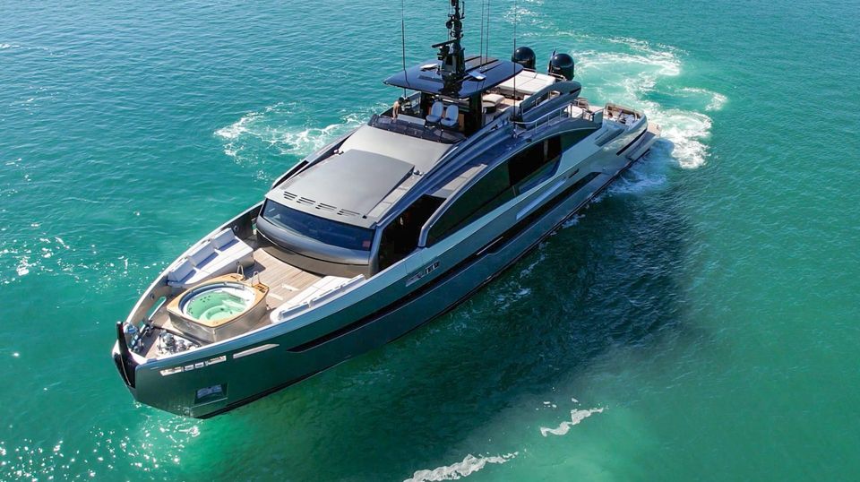 The 116 foot Pershing yacht cruising over turquoise water