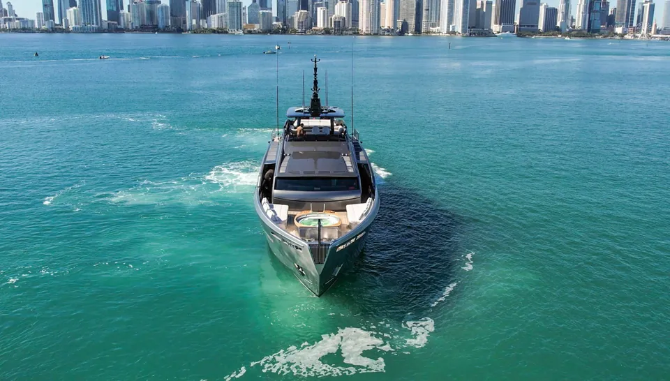 Pershing 116 yacht leaving a white wake on turquoise water near Miami