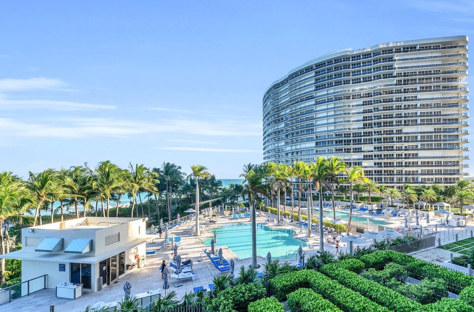 St. Regis Bal Harbour tower above its pools and gardens by the beach