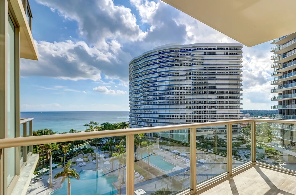 Ocean and resort pool view from a St. Regis Bal Harbour suite balcony