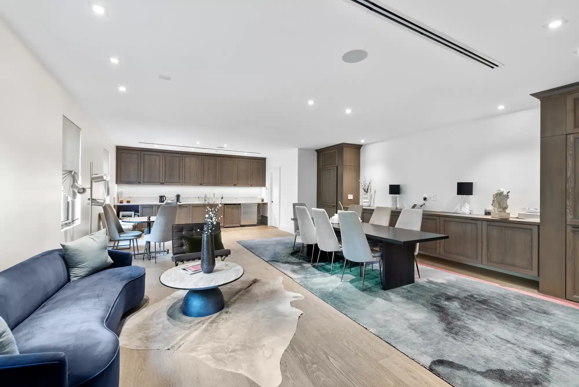 Bright modern living room in a Miami luxury villa with designer sofa and dining table