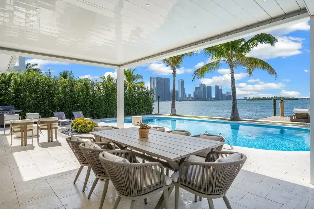 Alfresco dining table under the pergola beside the pool, Villa Venetian, Venetian Islands, Miami Beach