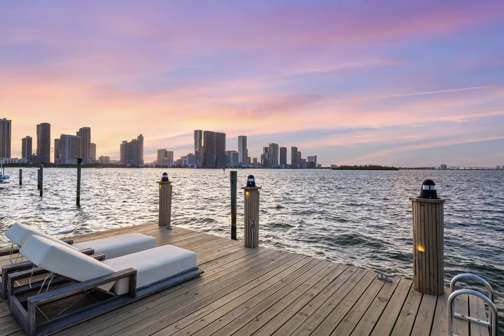 Private dock with loungers and the Miami skyline at sunset, Villa Venetian, Venetian Islands, Miami Beach