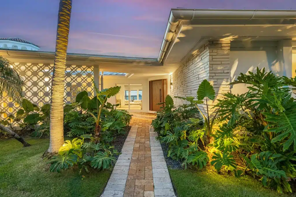 Tropical entrance walkway to the front door at dusk, Villa Venetian, Venetian Islands, Miami Beach