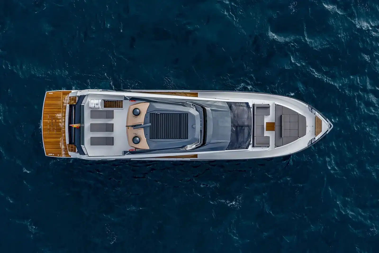 Aerial view of the 85 foot Astondoa flybridge yacht on deep blue water off Miami