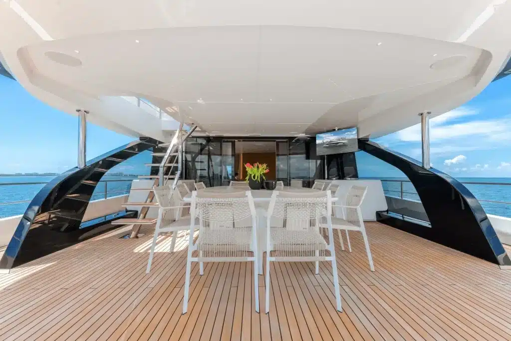 Large dining table on the aft deck of the 118 foot Azimut yacht