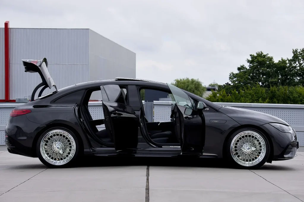 Black luxury car with its doors open, ready for a chauffeured ride