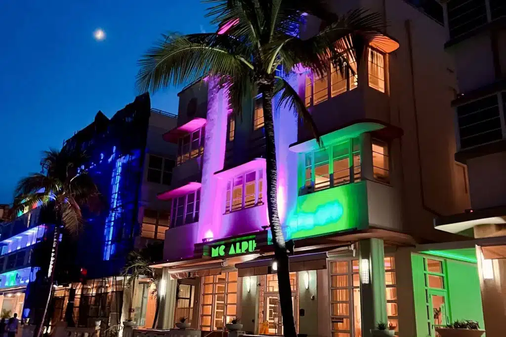 Art Deco buildings lit in neon on Ocean Drive, Miami Beach, at night