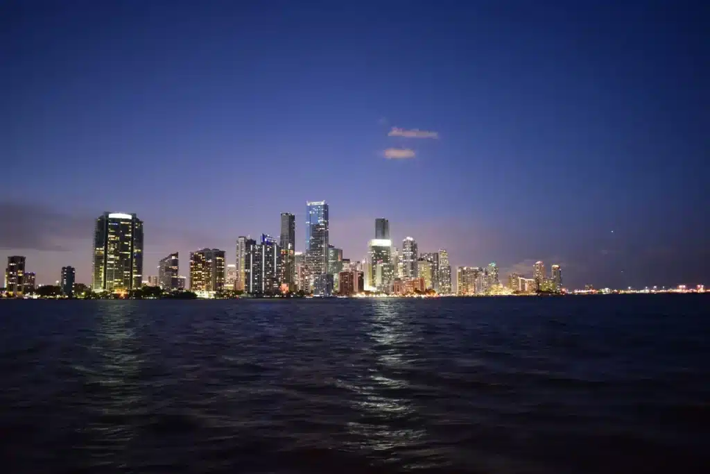 Miami skyline lit at dusk across Biscayne Bay