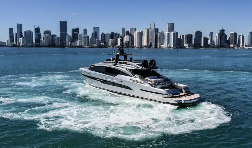 Pershing 116 yacht cruising on Biscayne Bay in front of the downtown Miami skyline