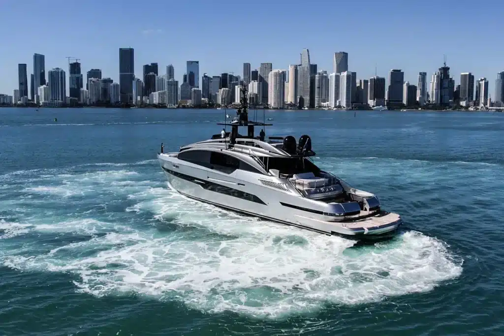 Pershing GTX 116 yacht at speed in front of the Miami skyline