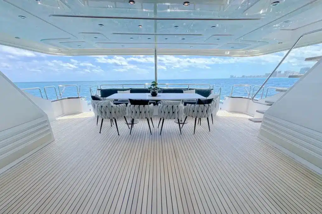 Yacht aft deck dining table for ten on the water off Miami