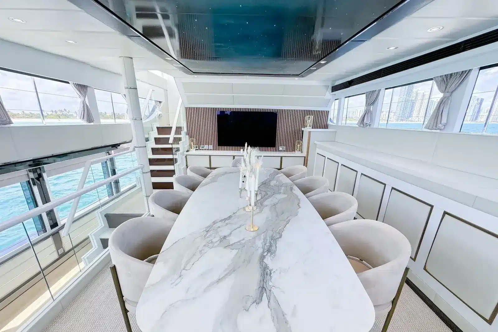 Bright main salon dining table on a crewed yacht in Miami